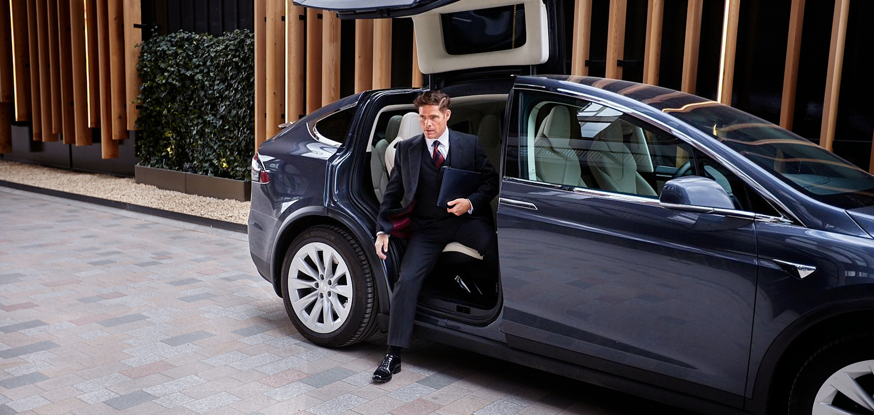 An executive arriving by car