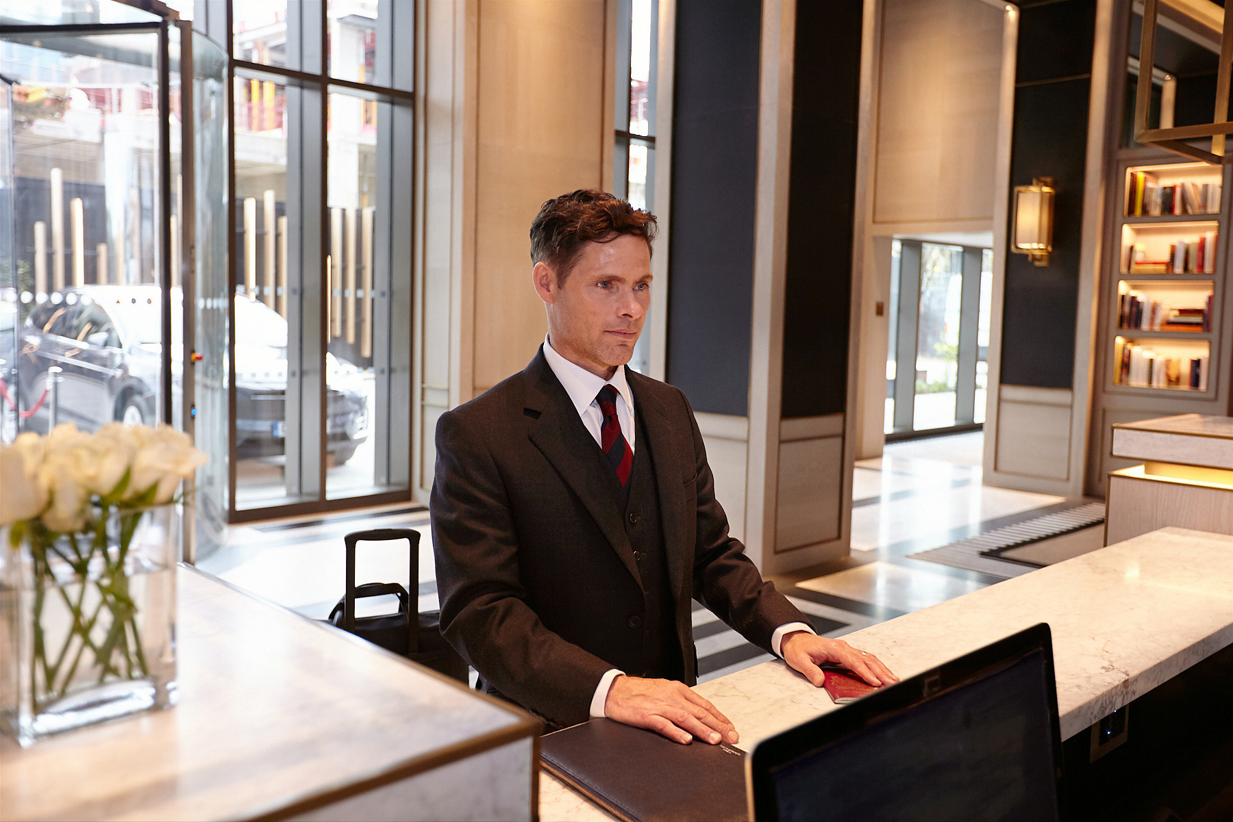 An investor arriving at a hotel